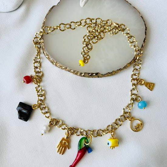 Goupi Goupi - Multi charm summer necklace and dark blue beaded necklace: Blue beaded