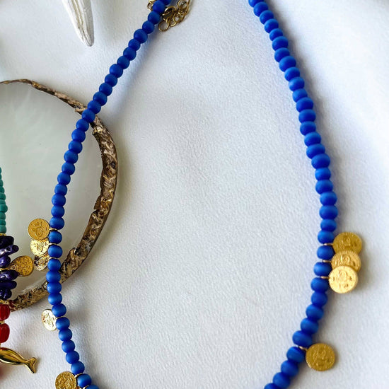 Goupi Goupi - Multi charm summer necklace and dark blue beaded necklace: Blue beaded